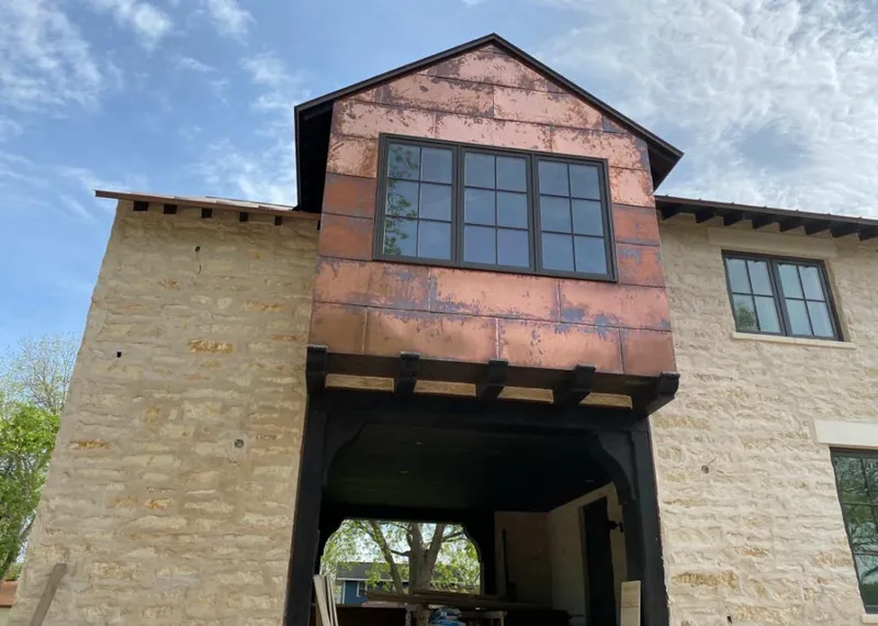 Copper metal panel facade on a stone building for Metal Roof Coating in Flat Rock